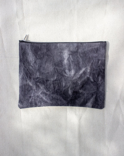 Black textured pouch on a white background